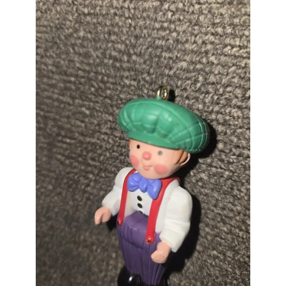 1998 Hallmark Miniature Christmas Ornament Boy Green Hat Purple Pants 2.5
